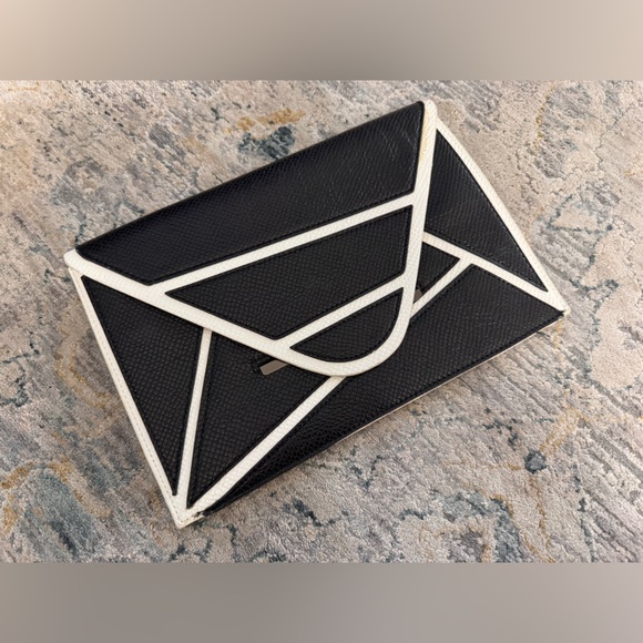 BCBGMaxAzria Handbags - BCBGMaxAzria Geometric Black and White Clutch